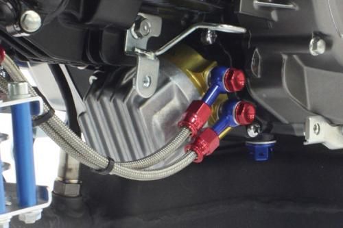 SP Takegawa compact oil cooler kit with standard/filter adaptor, featuring metal fins and hoses for efficient engine oil cooling.