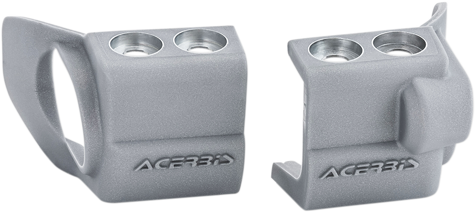 Silver ACERBIS Fork Shoe Protector for motorcycles, shown on the bike's front fork, designed to protect the fork from damage.