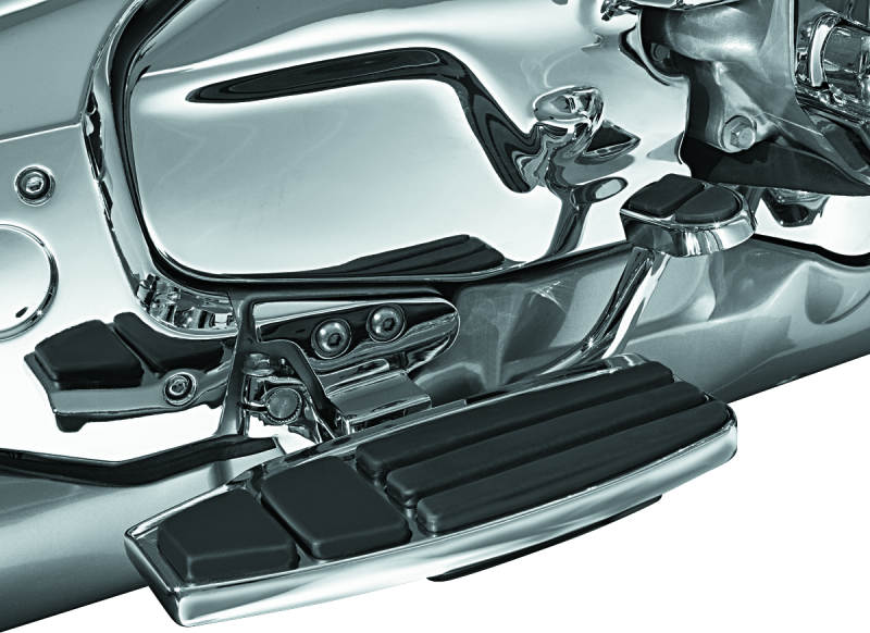 Kuryakyn driver floorboard kit in chrome for Honda Gold Wing GL1800 motorcycle, showing the detailed footrest and mounting hardware.