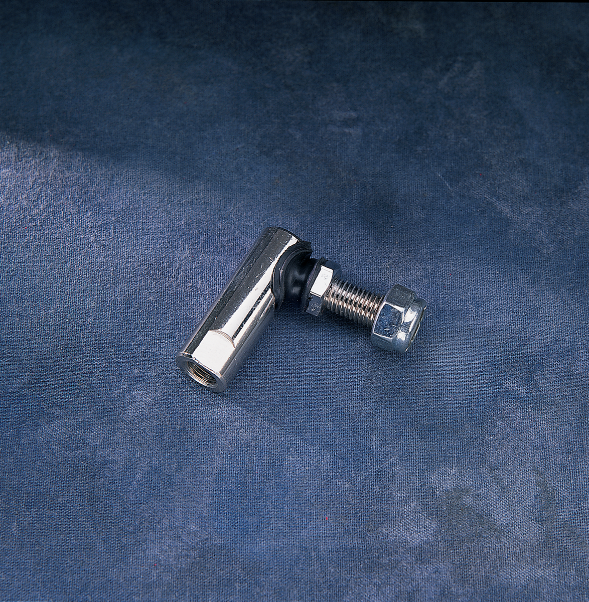 Chrome ball joint shifter for FL and FS Harley-Davidson models by Drag Specialties, shown with mounting details.