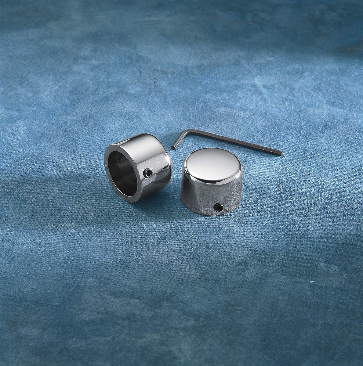 Chrome handlebar riser bolt caps by Drag Specialties for FX and XL motorcycle models, part #16-0205A-BC101.