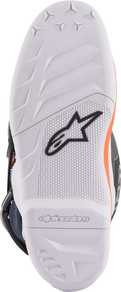 Alpinestars Youth Tech 7S motorcycle boots in black, orange, and white with buckle closures and reinforced toe area.