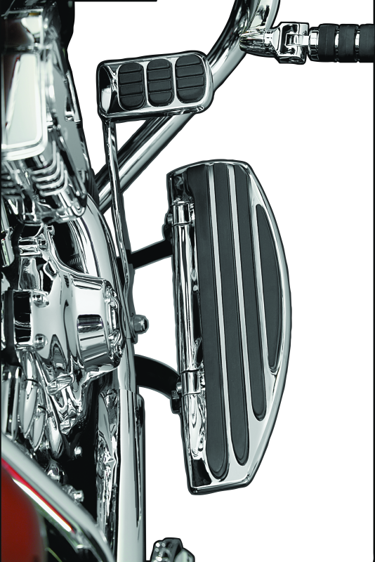 Kuryakyn Running Board Extensions for Harley-Davidson Touring models, showing chrome finish and extended foot support.
