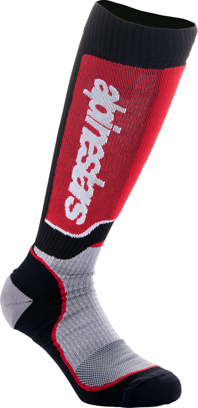 Alpinestars Youth MX Plus motocross socks in black, red, and gray, featuring reinforced areas and breathable fabric, in medium/large size.