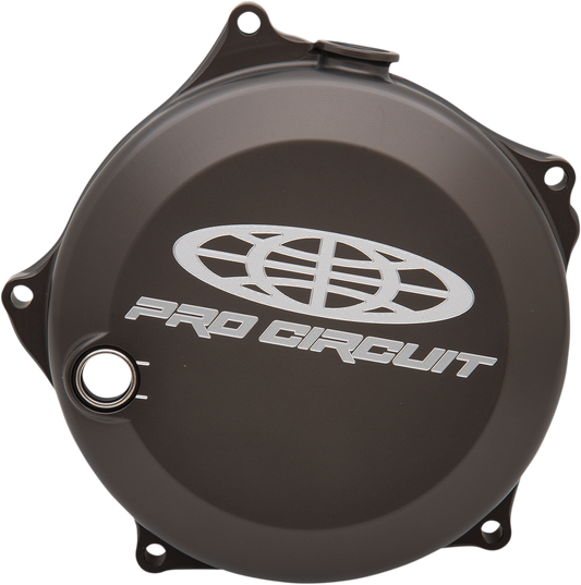 PRO CIRCUIT clutch cover for Kawasaki and Suzuki motorcycles, durable metal part with mounting holes and branding details.