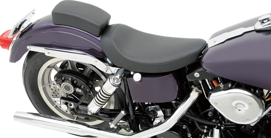 Low solo seat from Drag Specialties with smooth finish, designed for FX/FL motorcycles 1958-1984.