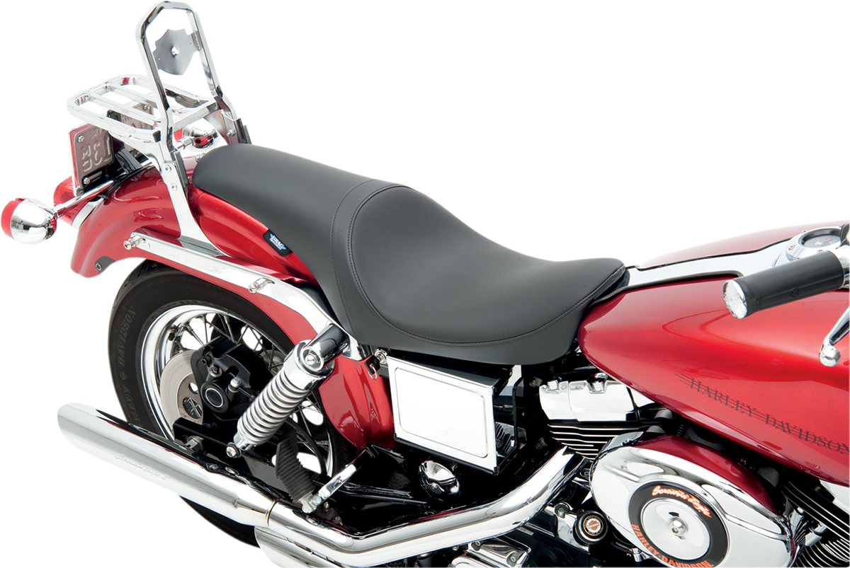 Drag Specialties Predator Seat for FXD 1996-2003, smooth black motorcycle seat shown on a Harley Davidson motorcycle.