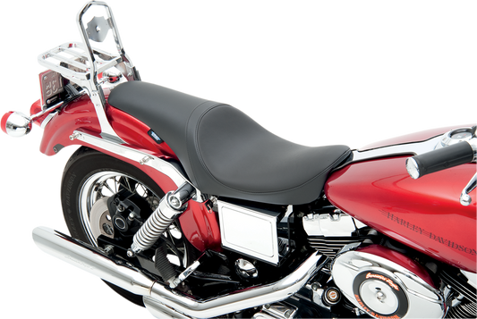 Drag Specialties Predator Seat for FXD 1996-2003, smooth black motorcycle seat shown on a Harley Davidson motorcycle.