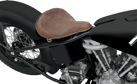 Drag Specialties large solo motorcycle seat with distressed brown leather and perimeter stitching for comfortable riding.