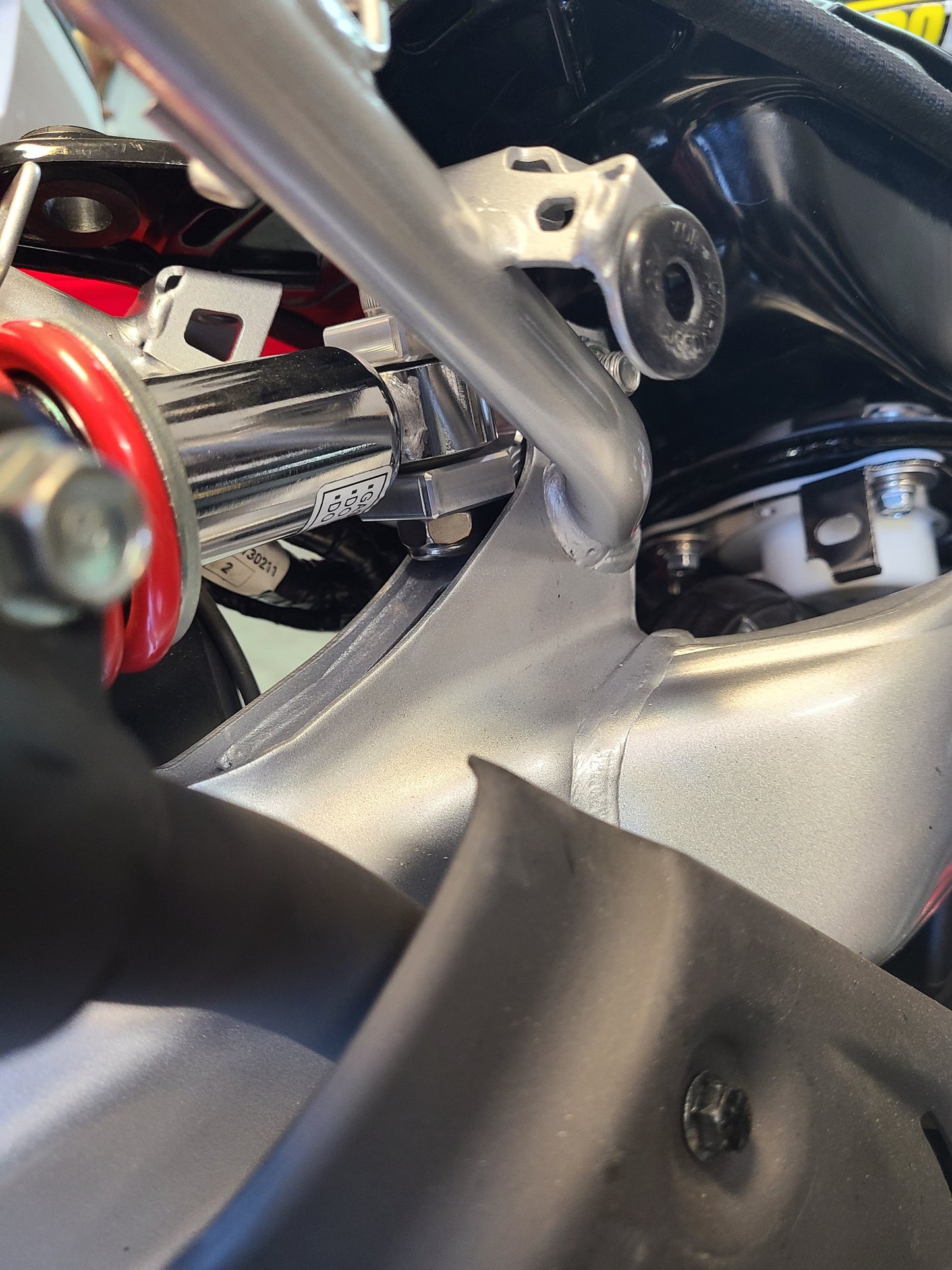 CRF110 REAR SHOCK EXTENDER - Howling Moto