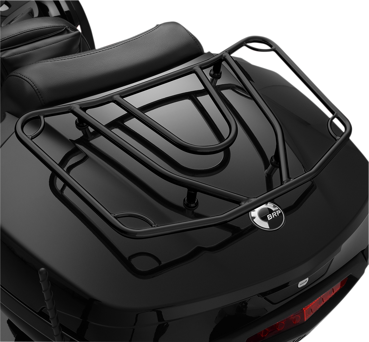 Bill's Exhausts SHOW CHROME Tour Trunk Luggage Rack in satin black mounted on motorcycle engine for touring gear storage.