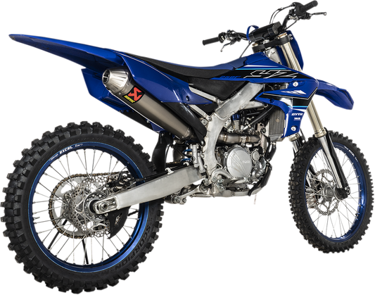 AKRAPOVIC Evolution titanium exhaust system for closed course competition, showing polished titanium pipes with branding details.