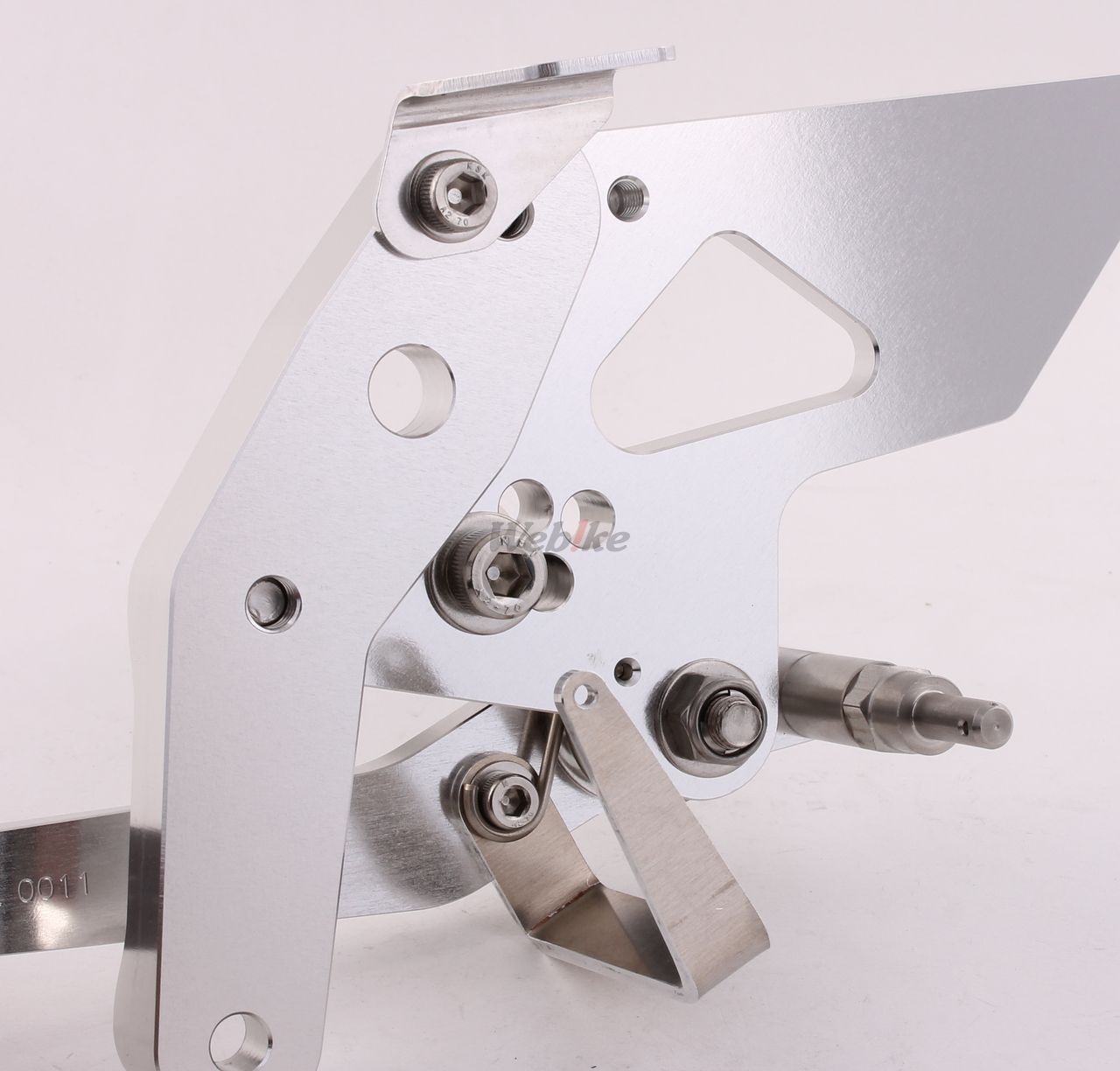 Over Racing rearsets with four adjustable positions for Honda Grom motorcycle, featuring metal footpeg and mounting hardware.