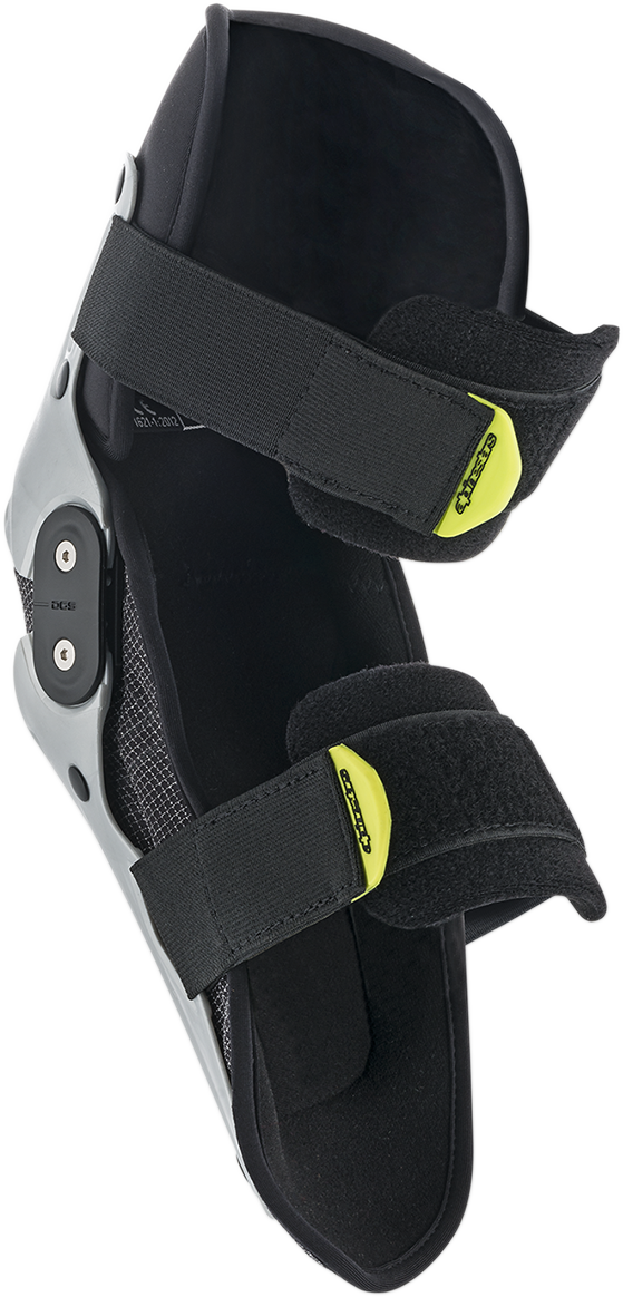 Alpinestars Youth SX-1 knee protectors in silver and yellow fluo, size S/M, designed for motocross and dirt bike protective gear.