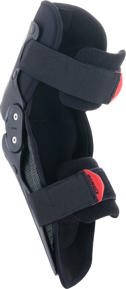 Alpinestars Youth SX-1 knee protectors in black and red, size small/medium, showing padded knee guards with straps.