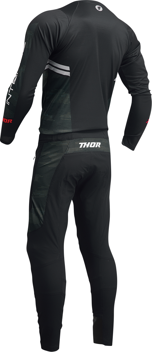 Black and camo THOR Intense Assist Berm long-sleeve jersey, designed for riding, featuring durable fabric and athletic fit.
