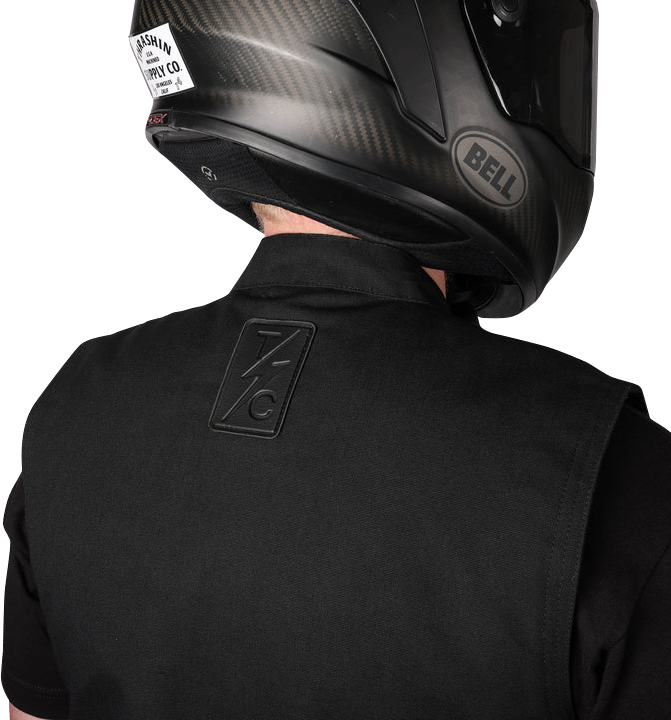 Black THRASHIN SUPPLY CO. Nightrider v2 riding vest in 2XL, featuring durable fabric and reflective details for motorcycle riding.