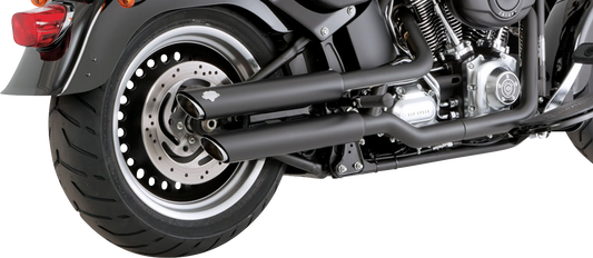 VANCE & HINES 3-inch twin slash slip-on mufflers with PCX technology in black, designed for motorcycle exhaust systems.