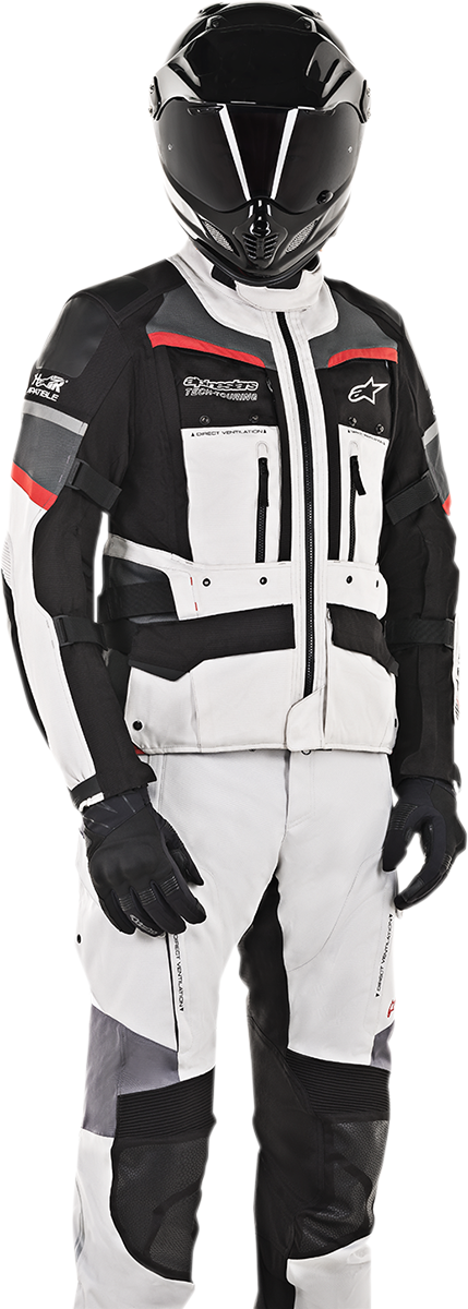 Alpinestars Andes Pro Drystar® motorcycle jacket in gray, black, and red with protective features, displayed on a hanger.