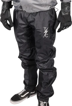 Black THRASHIN SUPPLY CO. Mission Rain Pants in size S/M, shown with waterproof fabric and adjustable waistband.