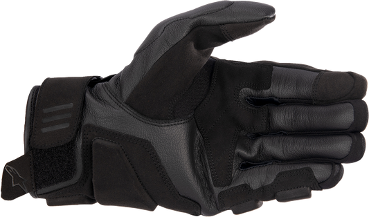 Alpinestars Phenom gloves in black and white, size XL, showing the protective design and textured material for motorcycle riding.