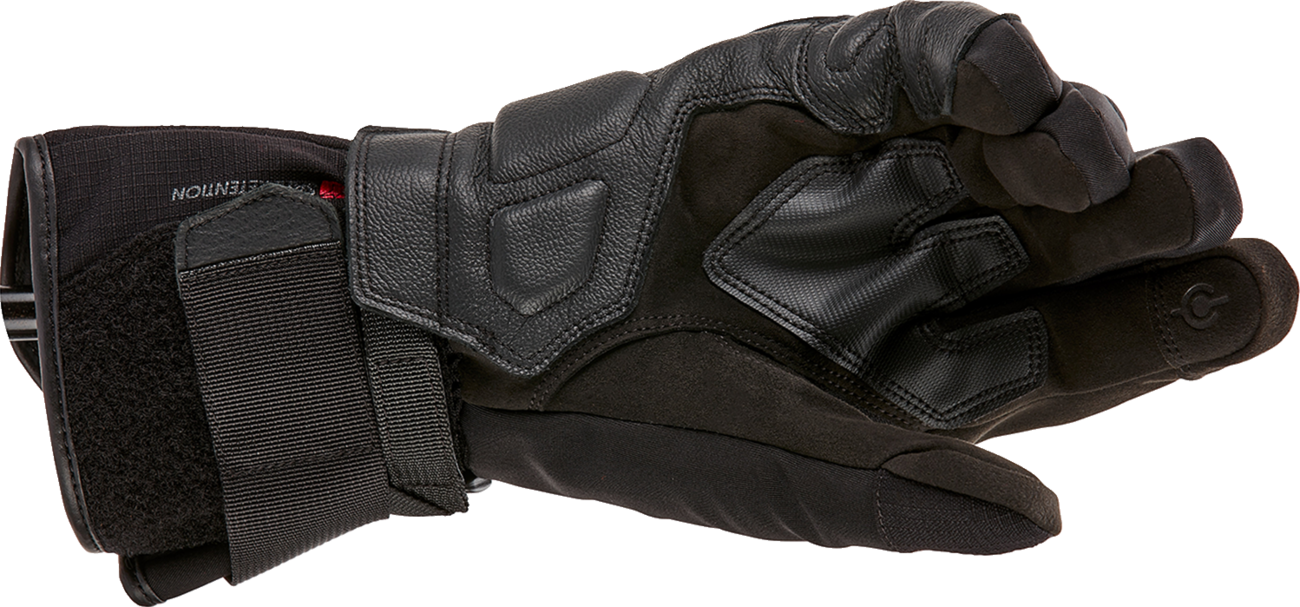 Alpinestars W-7 V2 Drystar winter motorcycle gloves in black, size XL, showing padded knuckles and textured grip palms.
