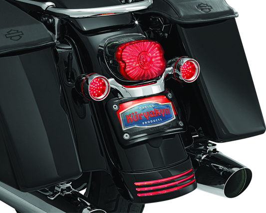 Kuryakyn curved license plate mount for Harley-Davidson Road and Touring models, part #3149, shown on motorcycle rear.