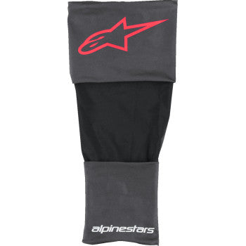 Alpinestars RK-S knee brace sleeves in black, red, and white, showing adjustable straps and protective padding for motorcycle riding.