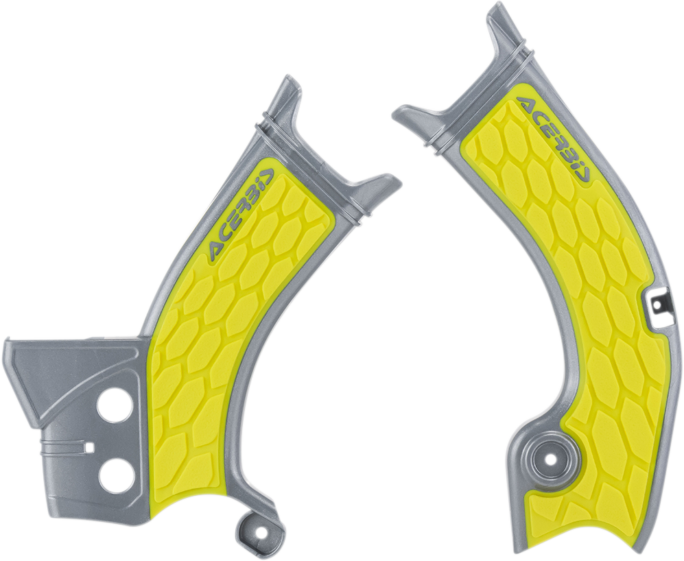 A close-up of ACERBIS X-Grip gray and yellow motorcycle frame guards on a body panel, showcasing durable protective design.