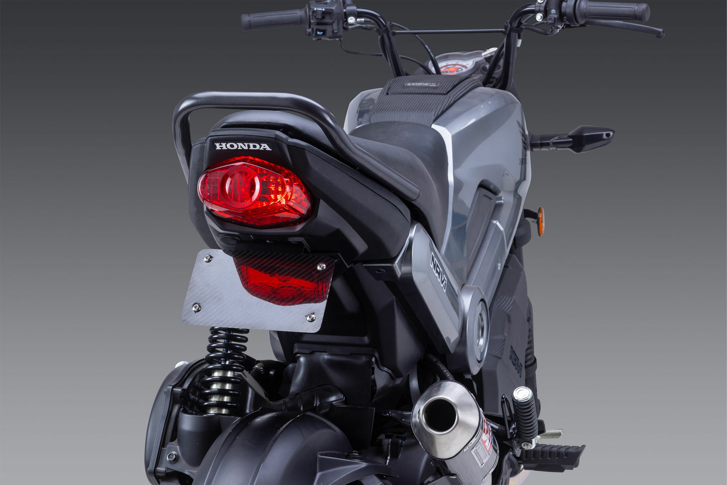 YOSHIMURA V2 Fender Eliminator Kit for Honda motorcycle, shown installed with sleek black design and integrated license plate holder.