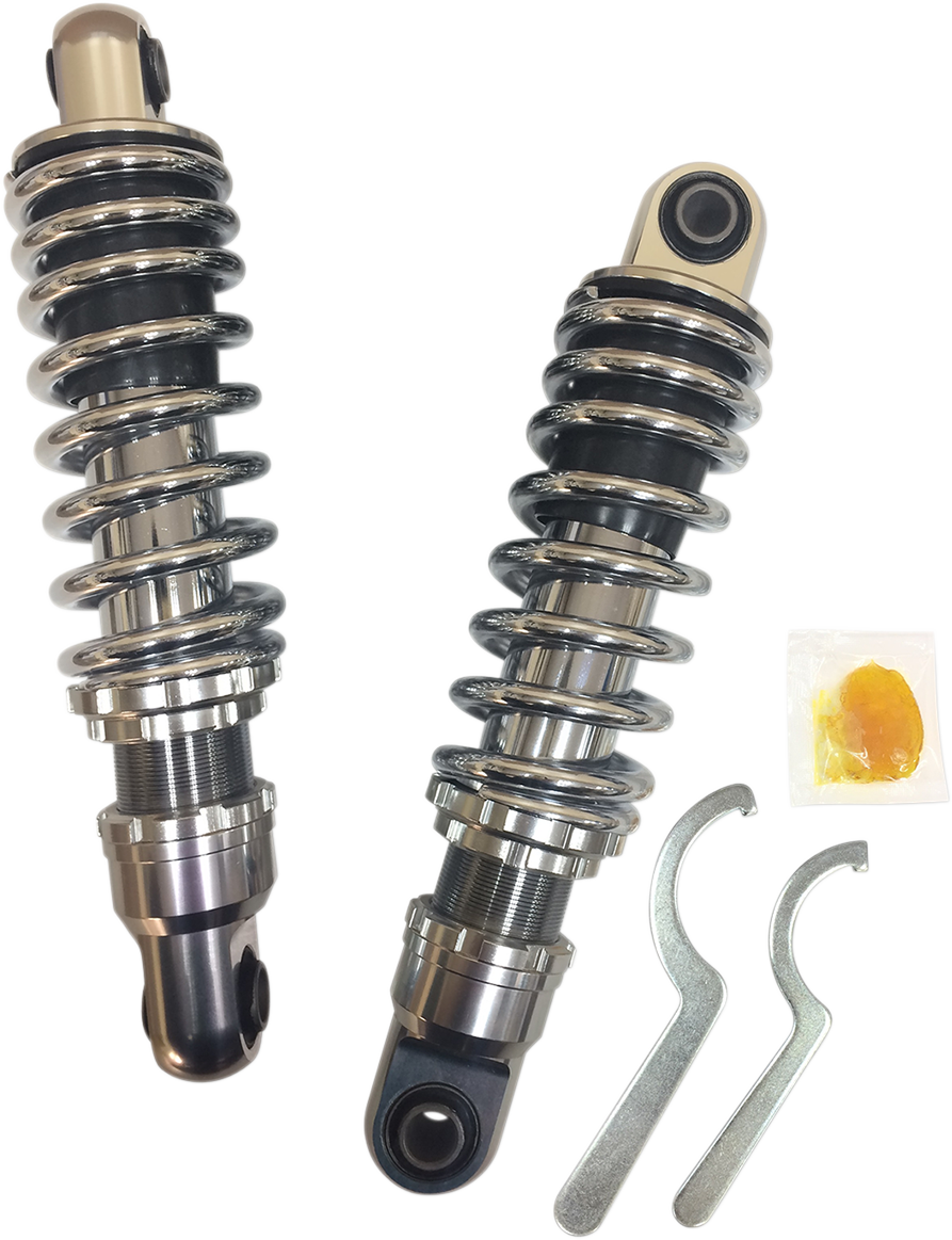 Chrome shock absorber for Harley-Davidson FXD, 10.5-inch premium Drag Specialties shocks installed on motorcycle.