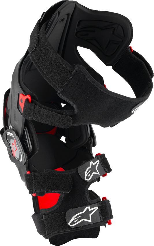 Alpinestars RK-7 Plasma knee brace in small black and red for high-performance off-road support, showing the brace's design and branding.