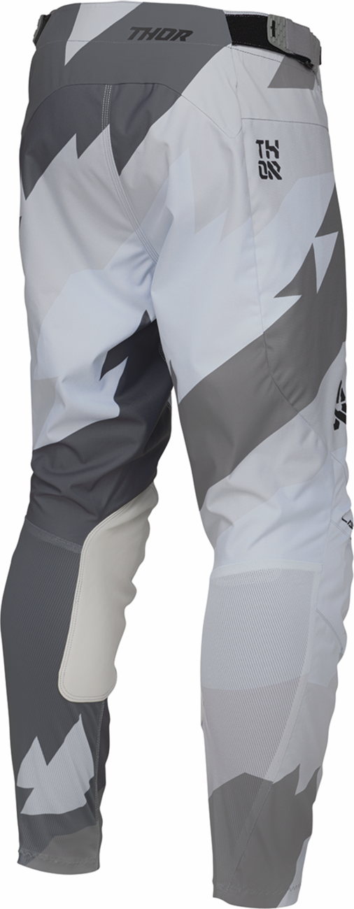 Black and gray THOR Launchmode Brave motocross pants with ventilation, durable material, and comfortable fit in US size 28.