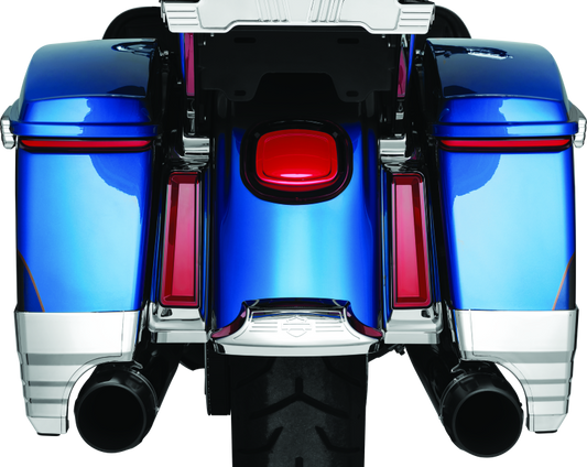 Kuryakyn Tracer Saddlebag Lights with red lens installed on a Harley Davidson Touring motorcycle for enhanced visibility and style.