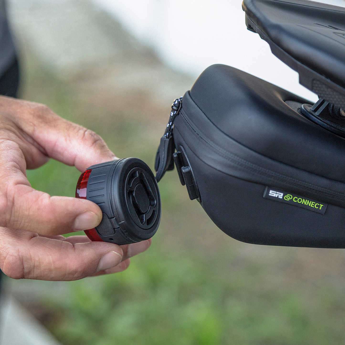 Bill's Exhausts SP CONNECT Saddle Case Set 53133 phone holder with saddle design, mounted on a bike handlebar.