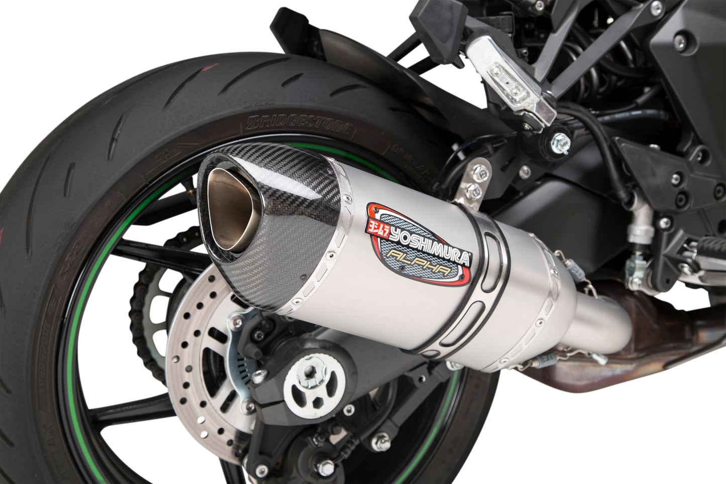 YOSHIMURA RS-12 ADV Street Alpha slip-on motorcycle exhaust for Kawasaki, featuring a sleek metal finish and compact design.