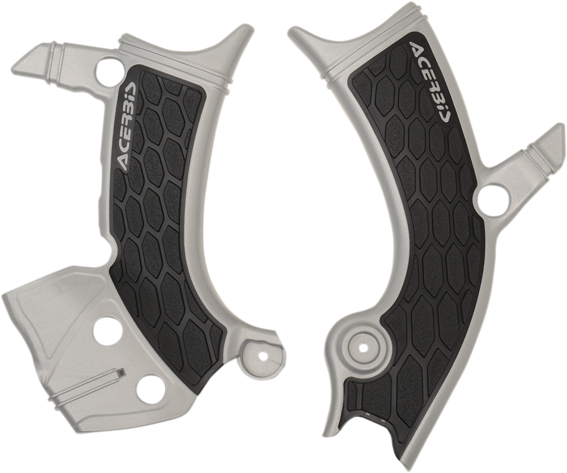 Acerbis X-Grip Frame Guards in silver and black mounted on a motorcycle frame for protection and style.