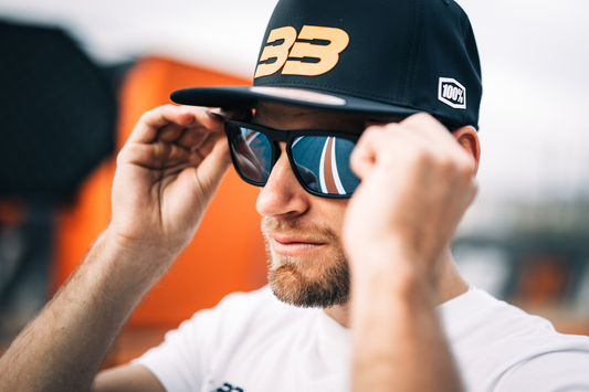 Bill's Exhausts BB33 Black and Fluo Orange hat, one size, with embroidered logo and sporty design, in a close-up image.