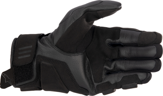 Alpinestars Phenom motorcycle gloves in black and white, 3XL size, with reinforced knuckles and breathable fabric, shown in image.