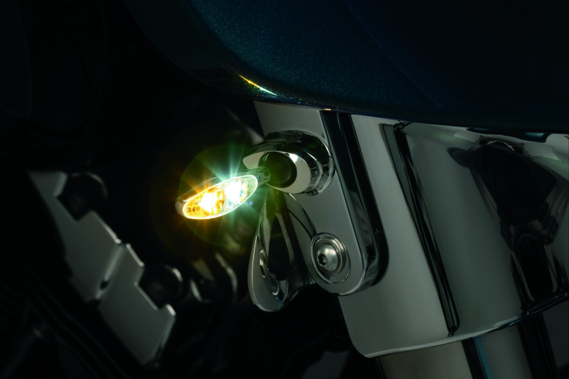 Kuryakyn Kellermann front turn signal mounts in chrome for Harley Davidson FLHX models, showing the sleek, polished design.