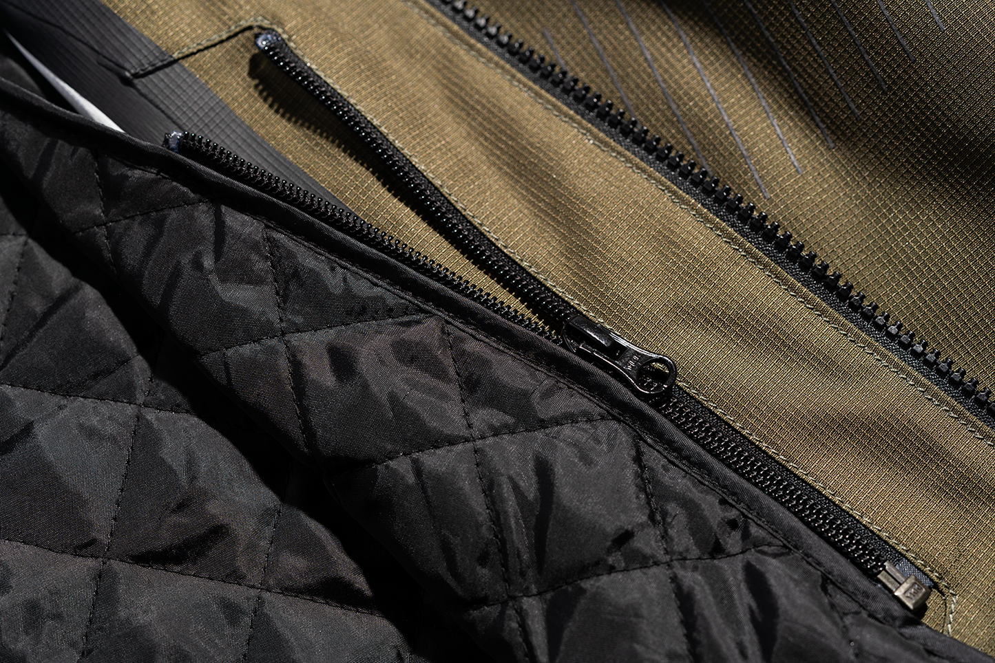Bill's Exhausts ICON PDX3™ Olive Jacket in Small, showcasing the stylish, lightweight jacket with a zip-up front and adjustable cuffs.