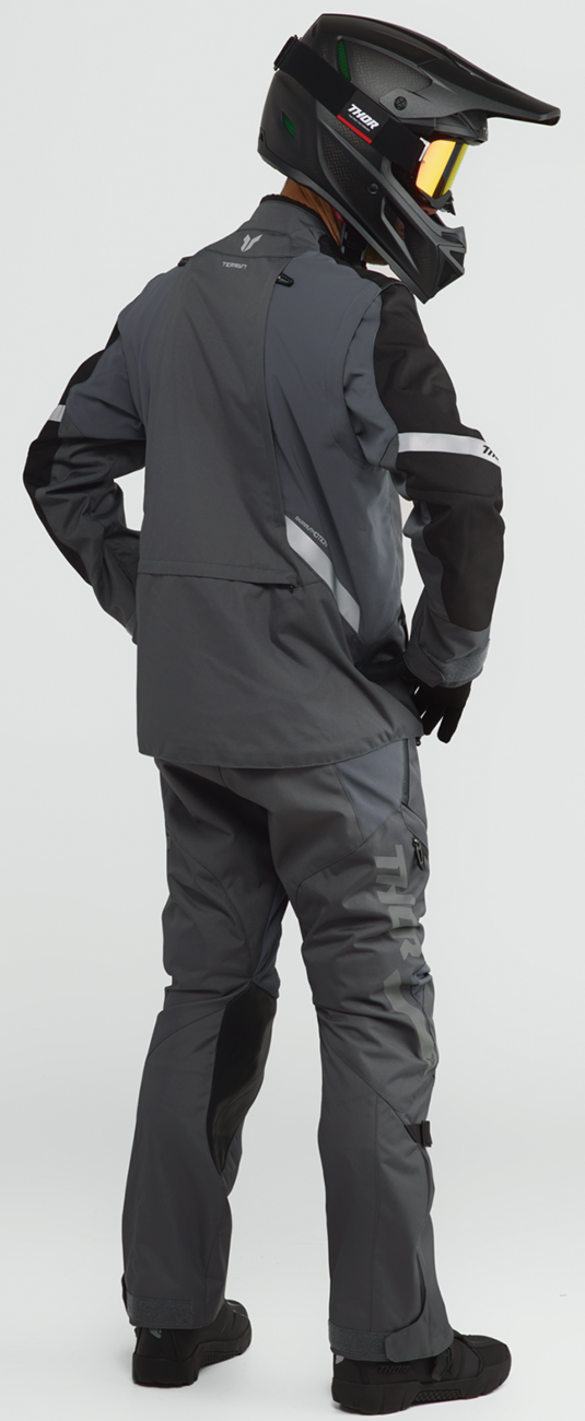 THOR Terrain over-the-boot pants in charcoal, US size 34, showing durable fabric and relaxed fit for outdoor riding.