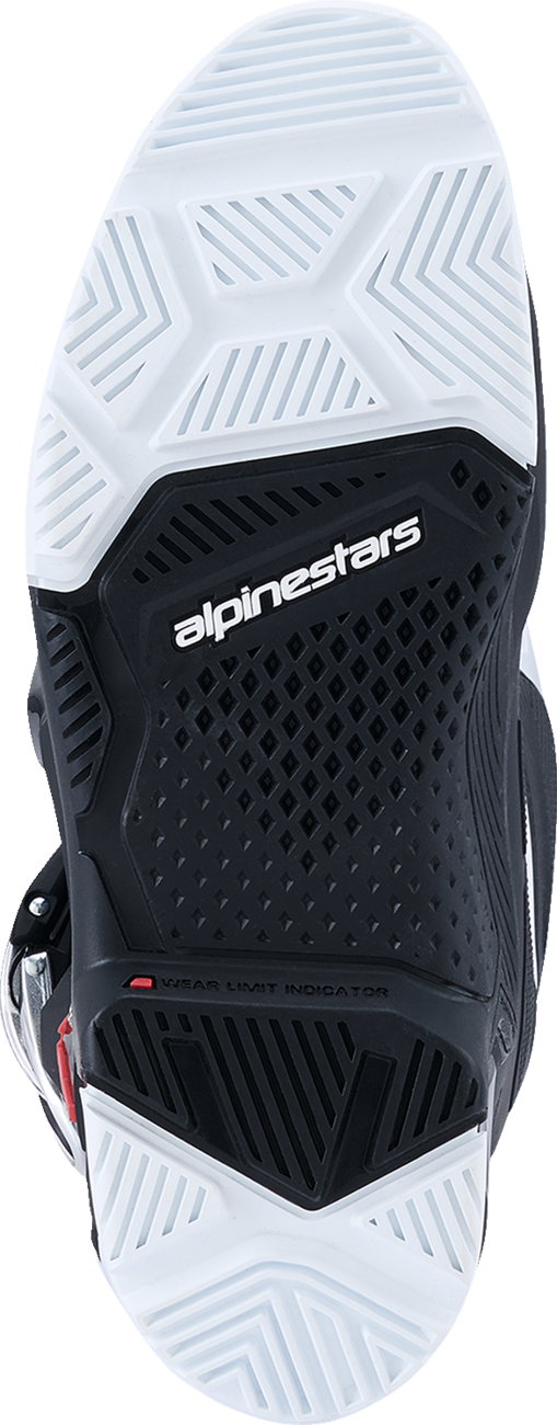 Alpinestars Tech 7 Enduro off-road boots in black and white, US size 8, showing durable, flexible motocross footwear design.