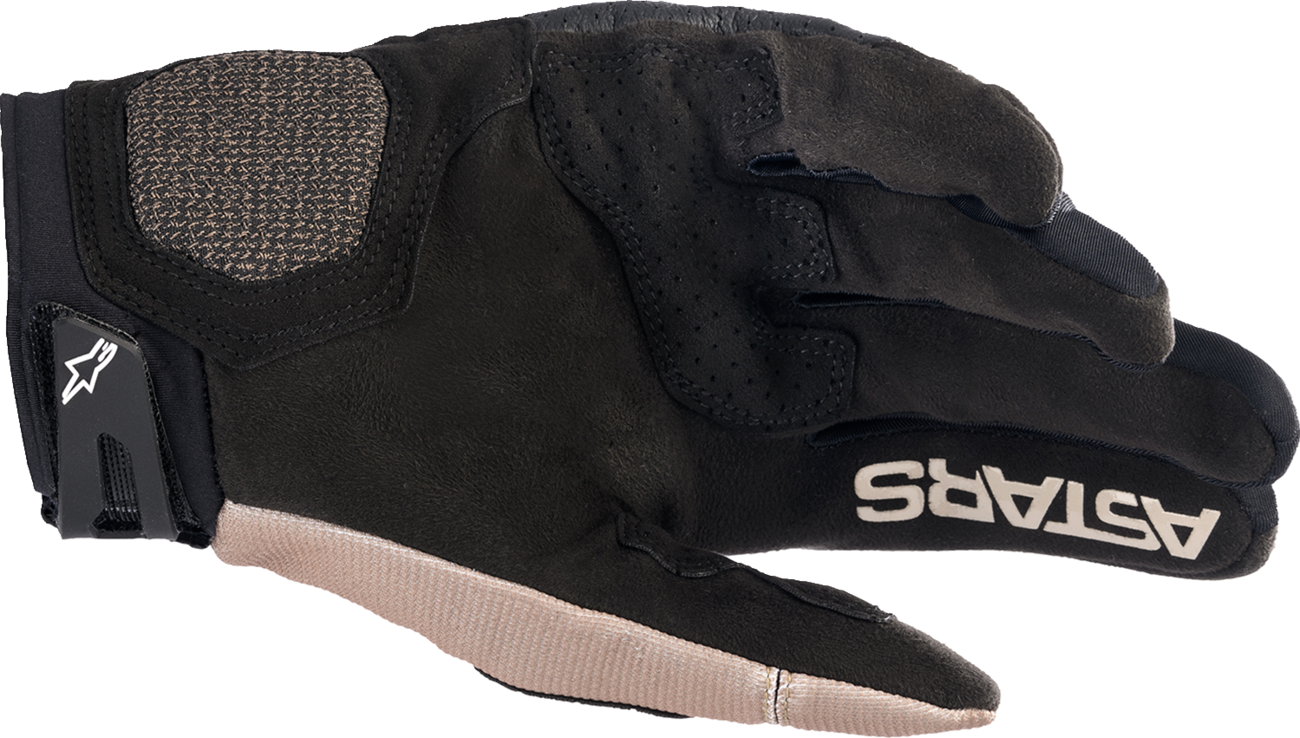 Alpinestars Megawatt V2 off-road gloves in stone and black with reinforced palms and adjustable wrist straps.