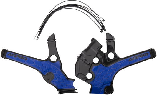 A set of Acerbis X-Grip black and blue motorcycle frame guards installed on a bike's body, showing detailed close-up of the protective covers.