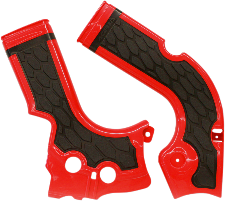 A set of ACERBIS X-Grip motorcycle frame guards in red and black, designed to protect the bike’s body and frame.