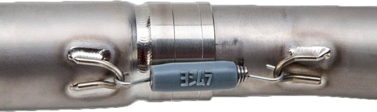 YOSHIMURA RS-12 Signature Series dirt bike exhaust system with stainless steel aluminum construction and carbon fiber end cap visible.