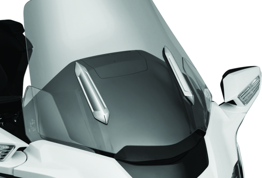 Kuryakyn Omni Windshield Trim in chrome for Honda GL1800 motorcycle, showing the shiny, curved trim piece installed on the windshield.