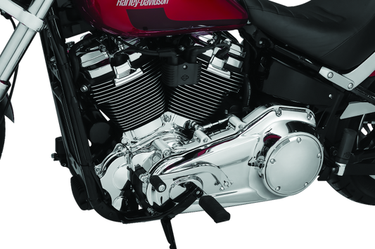 Kuryakyn Chrome Inner Primary Cover for Harley Davidson motorcycles, showcasing a shiny, reflective finish on the cover part.