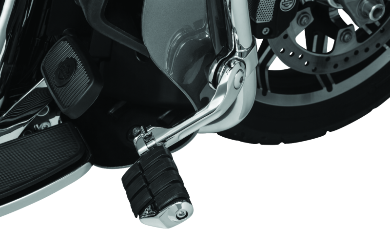 Kuryakyn Tour-Tech Cruise 6-inch mount arm with chrome finish and dually ISO pegs on 1-1/4 inch engine guards for motorcycle cruising